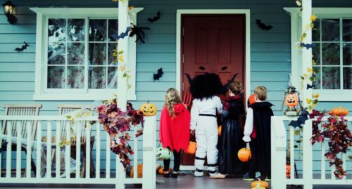 kids trick or treating at house on halloween