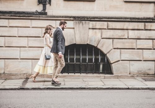 couple walking on sidewalk