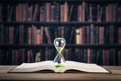 hourglass on a book